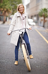 Image showing Woman, portrait and city with vintage bicycle for eco friendly transport with smile, pride and outdoor. Girl, person and retro bike on street, road and travel with sustainability in Cape Town metro