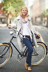 Image showing Woman, portrait and city with retro bicycle for eco friendly transport with smile, pride and outdoor. Girl, person and vintage bike on street, road and travel with sustainability in Cape Town metro