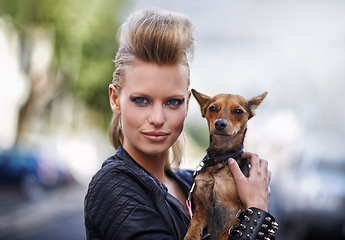 Image showing Woman, portrait and punk fashion with dog, edgy rock hairstyle and cool in funky clothes with care for pet chihuahua. London, person and face in leather jacket in town and city for domestic animal