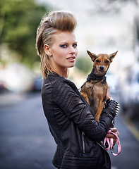 Image showing Woman, portrait and leather jacket with dog, happy and rock n roll for unique in punk fashion and city for pet chihuahua. London, person and face in funky clothes in town and care for domestic animal
