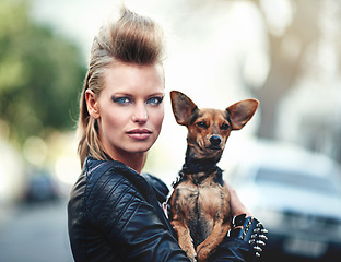 Image showing Woman, portrait and punk fashion with pet, edgy and rock n roll for cool in funky clothes and care for chihuahua dog. London, person and face in leather jacket in town and love for domestic animal