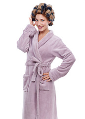 Image showing Portrait, hair and woman with curlers in studio, morning routine and preparation for hairstyle. Female person, cosmetic treatment and rollers for grooming, white background and robe for beauty