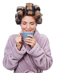 Image showing Face, coffee and curlers in hair of woman in studio isolated on white background for salon treatment. Smile, beauty and aroma with happy young person in bathrobe for morning routine and haircare