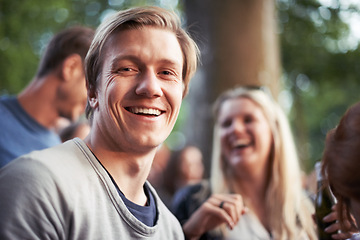 Image showing Portrait, smile and man camping with friends outdoor in forest or woods for travel, festival or vacation. Face, nature or summer with happy young person and group of people together for adventure