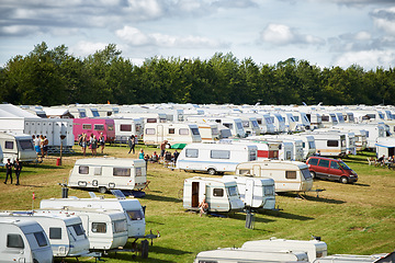 Image showing Camping, caravan and outdoor music festival in park for celebration on fun holiday vacation in summer. Travel, people or shelter at party, event or concert in field for campsite or crowded carnival