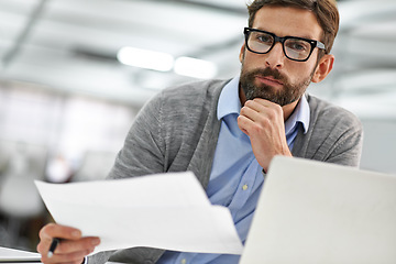 Image showing Businessman, portrait and laptop with documents in finance, budget planning or investment at office. Man, accountant or employee with paperwork, financial report or policy by computer at workplace