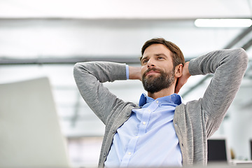 Image showing Happy, rest and business man in office thinking, daydreaming and relax on break at desk. Hands on head, corporate worker and person with computer done for project, working and finish in workplace