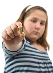 Image showing Girl Showing Pill