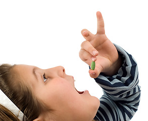 Image showing Child Taking Pill