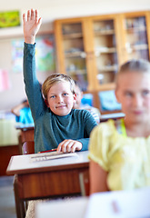 Image showing Question, student and hand raised for information in classroom, solution and boy at school. Male person, asking and curious for answer on curriculum, learning and studying or education for growth