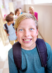 Image showing Student, portrait and excited child with smile in hallway with education, study and backpack for back to school. Youth, young boy and learning on campus with children and happy from class and fun