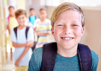 Image showing Student, portrait and child with smile in hallway with education, study and backpack for back to school. Youth, young boy and learning with confidence on campus with children and happy from class