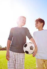 Image showing Soccer, friends and playing with ball on field, support and smile for sports game on grass. Boys, children and performance on outdoor pitch, bonding and pride for collaboration in football challenge