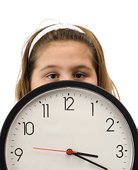 Image showing Girl Hiding Behind Clock