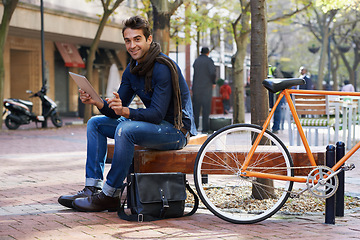 Image showing Portrait, city and smile with man, tablet and bicycle with adventure and travel with internet and social media. Person, outdoor and New York with guy and technology with connection and meme with app