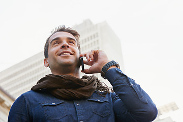 Image showing City, phone call and man with smile, conversation and communication with network and happy. Person, low angle and connection with smartphone and mobile user with sunshine and contact with urban town