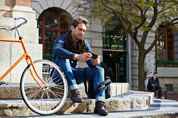 Image showing Relax, city and smile with man, smartphone and bicycle with adventure and travel with internet and social media. Commute, outdoor and New York with guy and cellphone with connection and digital app