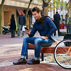 Image showing Bench, city and smile with man, smartphone and bicycle with adventure and joy with internet and social media. Person, outdoor or New York with hipster and cellphone with connection or typing with app