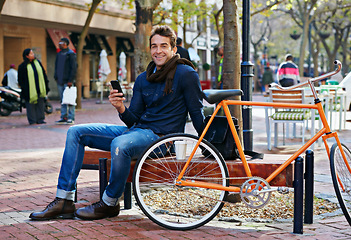 Image showing Portrait, outdoor and smile with man, cellphone and bicycle with adventure and travel with internet and social media. Person, bench or New York with digital app and smartphone with connection or meme