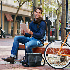Image showing Portrait, outdoor and smile with man, tablet and bicycle with connection and relax with internet and social media. Person, funny and New York with guy and technology with digital app or communication