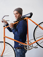 Image showing Man, studio and bicycle for sustainability, exercise and transportation on white background. Hipster cyclist, carbon neutral and eco friendly travel for environmental commute or fitness and trip