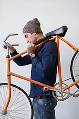 Image showing Man, studio and bike for sustainability, transportation or exercise on white background. Hipster cyclist, carbon neutral and eco friendly travel for environmental commute or fitness and trip