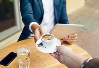 Image showing Waiter, serving and hands with coffee on table at cafe with customer reading tablet for internet, news or article. Restaurant, service or person pov giving espresso to man with tech on social media