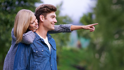 Image showing Couple, smile and happiness with pointing finger in park, outdoor setting and bonding with activities. Relationship, goals and romance with fun day in forest for lifestyle, wellness and relax