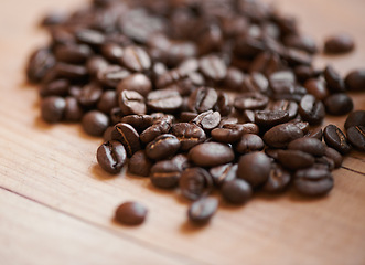 Image showing Coffee beans, counter and espresso drink or caffeine preparation for beverage, cafe or cappuccino. Roasted, blend and ingredient for latte or restaurant barista for kitchen scent, breakfast or grind