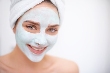 Image showing Women, face mask and skin care for portrait, bathroom and acne for organic rejuvenation. Female person, towel and smile with treatment, wellness and spa day for beauty and relaxation for hygiene