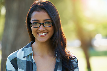 Image showing Woman, portrait and student outdoors on campus, eyewear and pride for education in nature. Female person, confidence and glasses for learning or enjoying park or garden, happy and positive outside