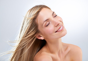 Image showing Beauty, hair and face of woman in studio with natural makeup, smile and straight balayage hairstyle. Haircare, cosmetics and happy model with keratin growth, relax and girl on white background.