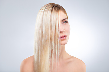 Image showing Straight hair, beauty and blonde woman in makeup, care or thinking isolated on a white studio background. Face, hairstyle and serious model in cosmetics, hairdresser and salon treatment for keratin