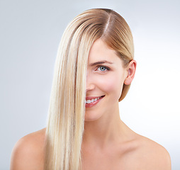 Image showing Straight hair, beauty and portrait of happy woman in makeup isolated on a white studio background. Face, hairstyle and smile of blonde model in cosmetics, hairdresser and salon treatment for skincare