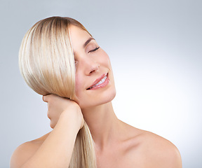 Image showing Hair care, hand and beauty of blonde woman with eyes closed, makeup and isolated on a white studio background. Face, touch and hairstyle of happy model in cosmetics, hairdresser and salon treatment