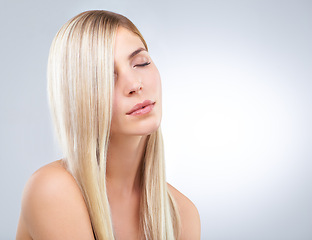Image showing Straight hair, beauty and woman with eyes closed in makeup isolated on a white studio background. Face, hairstyle or blonde model in cosmetics, hairdresser or salon treatment for care on mockup space