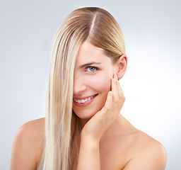 Image showing Straight hair, touch and portrait of happy woman, skincare or makeup isolated on white studio background. Face, hand or hairstyle of blonde model in cosmetics, hairdresser or beauty treatment in spa