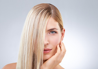 Image showing Straight hair, hand and portrait of blonde woman, beauty and makeup isolated on a white studio background. Face, touch and hairstyle of model in cosmetics, skincare or salon treatment on mockup space