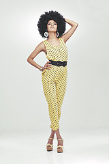 Image showing Black woman, fashion and retro with portrait in studio for vintage, unique look and face with afro. African girl, stylish and person with curly hair, jumpsuit and confident with white background