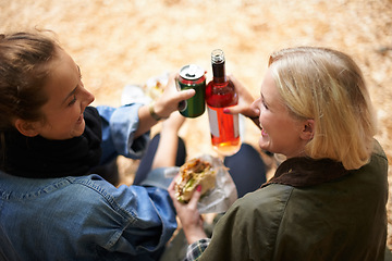 Image showing Friends, women and cheers with alcohol and toast for party, relax and celebration with food outdoor. Top view, people and wine bottle with burger, drinks and happy at event, carnival and weekend fun