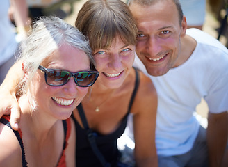 Image showing Portrait, people and happy friends at festival outdoor, bonding and having fun together at celebration in summer. Face, smile and group of mature women, man and party at carnival for social event