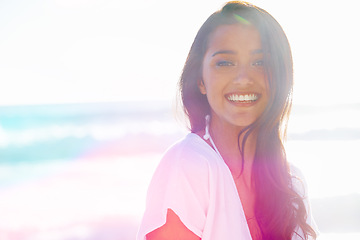 Image showing Indian woman, beach and smile for ocean, waves and breeze for summertime in Bali for vacation. Female, sea and holiday relaxation abroad in swimsuit, sand and lens flair portrait and memories