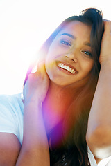 Image showing Mexican woman, portrait and smile for outdoor, travel and breeze for summertime in Bali for vacation. Female person, lens flare and relax abroad in holiday outside and happy for nature and break