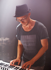 Image showing Jazz musician, playing and piano on stage at night for solo performance and album launch in Canada. Hipster with electronic keyboard at rock, music and festival for sound, audio and live gig