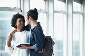 Image showing Couple, hug and students with a book, education and conversation for research and embrace. College, man and woman with ideas or brainstorming with planning and teamwork with knowledge and learning