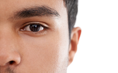 Image showing Eyes, closeup and portrait of man in studio for vision, wellness or examination on white background. Eye test, face and model with eyesight assessment for contact lens, wellness or eyeball health