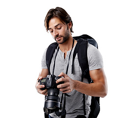 Image showing Man, camera and photography with technology in studio, press or media on white background. Photographer, photo journalist check work and creativity with paparazzi, equipment and backpack in studio