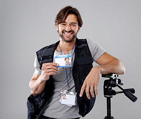 Image showing Man, portrait with press or media, cameraman in studio for interview or news, photographer and ID card on grey background. Photo journalist, reporter or paparazzi, identification and professional