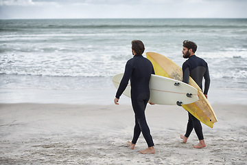 Image showing Man, friends and surfer at beach for waves, sport or exercise on sandy shore in outdoor fitness. Rear view of male person or people with surfboard for surfing on ocean coast, sea or water in nature