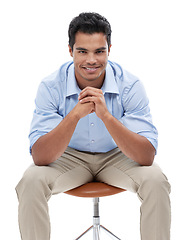 Image showing Business man, portrait and happy in studio, corporate employee and career in sales on white background. Professional, positivity and pride with smile, salesman sitting in chair and confidence